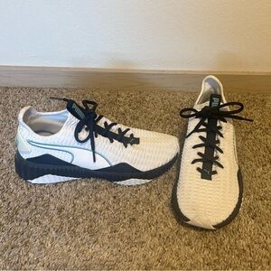 Women’s Puma shoes in black and White